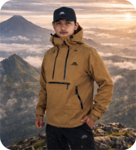 Lapisan luar (outerwear) berupa jaket waterproof berkualitas untuk perlindungan maksimal saat pendakian cuaca ekstrem